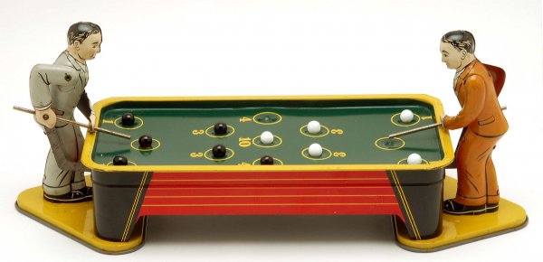 Ranger Billiard Table Pool Players Tin Wind-Up: DESCRIPTION: Ranger lithographed tin wind-up Billiard Table pool players toy. With five white and six black glass balls. MEASUREMENTS: 14-1/2". CONDITION: Working condition with only very minor wear. 