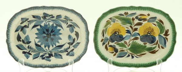 2 Leeds Pearlware Serving Bowls: DESCRIPTION: Two Leeds pearlware oval serving bowls with scalloped rims. One decorated with polychrome pansies with green rim and one in all blue floral decoration. 18th/19th century. MEASUREMENTS: 8-
