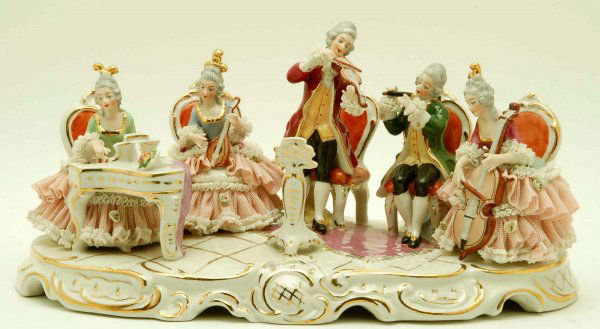 Large Dresden Figural Group Playing Instruments: DESCRIPTION: A large Dresden porcelain figural group of five figures playing instruments on a raised oval gilt trimmed base. Marked under base in blue "WR Dresden Art Made in Germany". MEASUREMENTS: 1