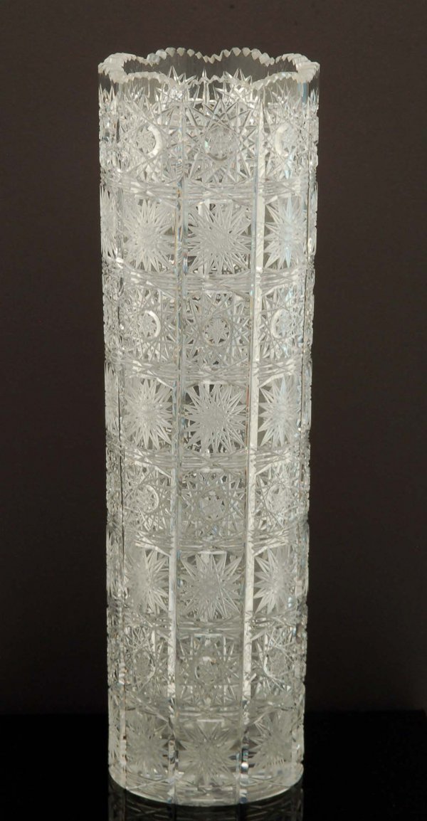 14" Queen Lace Crystal Cylinder Vase: DESCRIPTION: A Queen Lace lead crystal cylinder vase having all over squares cut with multipoint stars. MEASUREMENTS: 14". CONDITION: No defects noted.