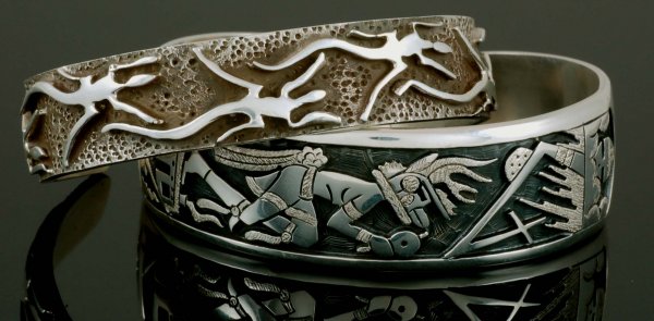2 Hopi Cuffs Verden Mansfield Danny Romero: DESCRIPTION: Two Hopi silver overlay cuff bracelets. One depicting a dancing figure marked with antelope mark for Verden Mansfield. The other having design of repeating lizards signed to interior for 