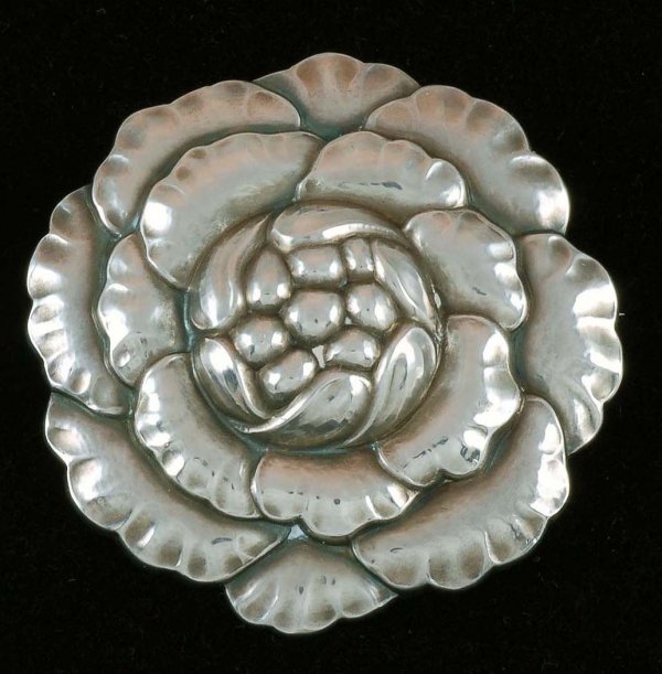 Georg Jensen Sterling Flower Pin: DESCRIPTION: A Georg Jensen sterling pin of a flower. Marked "George Jensen Sterling Denmark 176". Mid twentieth century. MEASUREMENTS: 1-3/4". CONDITION: No defects noted.