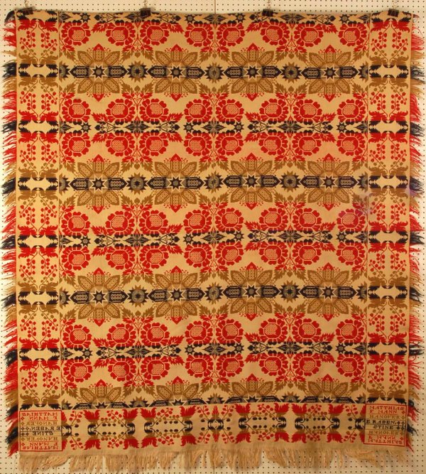 Jacquard Coverlet Matthias F. Mann Hanover: DESCRIPTION: Woven jacquard coverlet with red, white, blue and green wool yarns. Oak leaf and acorn with geometric pattern. Corner block reads "Matthias F. Mann Hanover E. Rabenstine". Polychrome wool