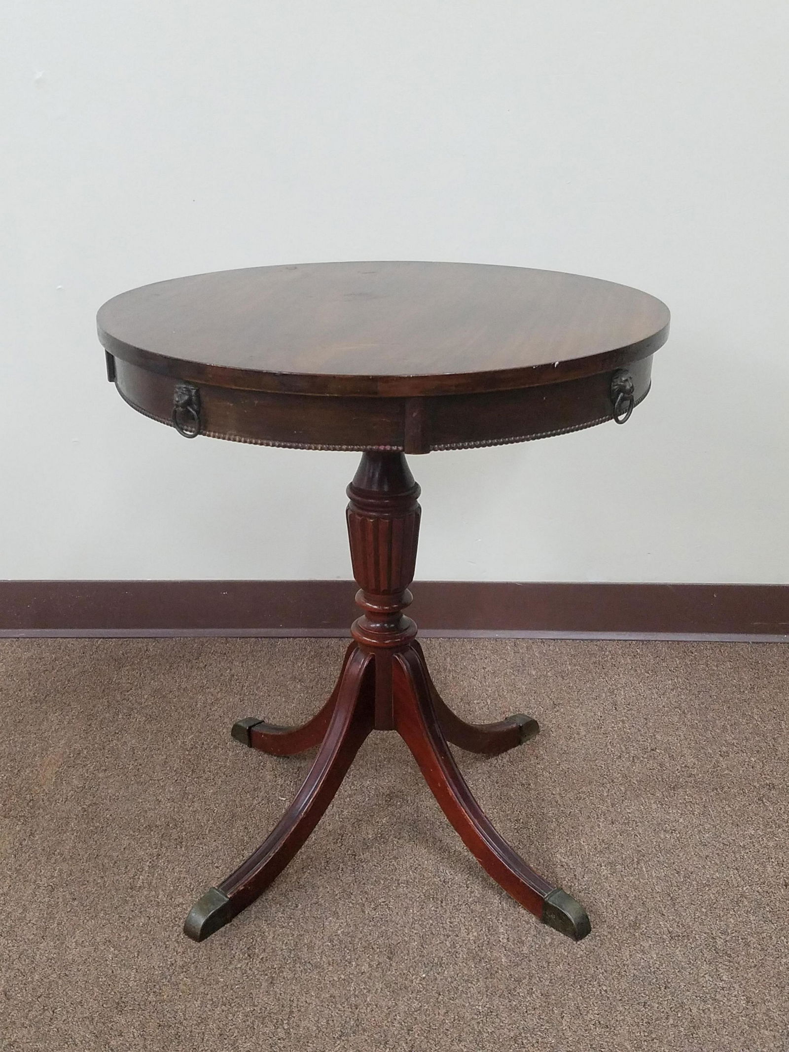 Drum Table: Has 4 Lion pulls for faux drawers. 23-3/4" diameter x 26" high. Some scratches to wood finish