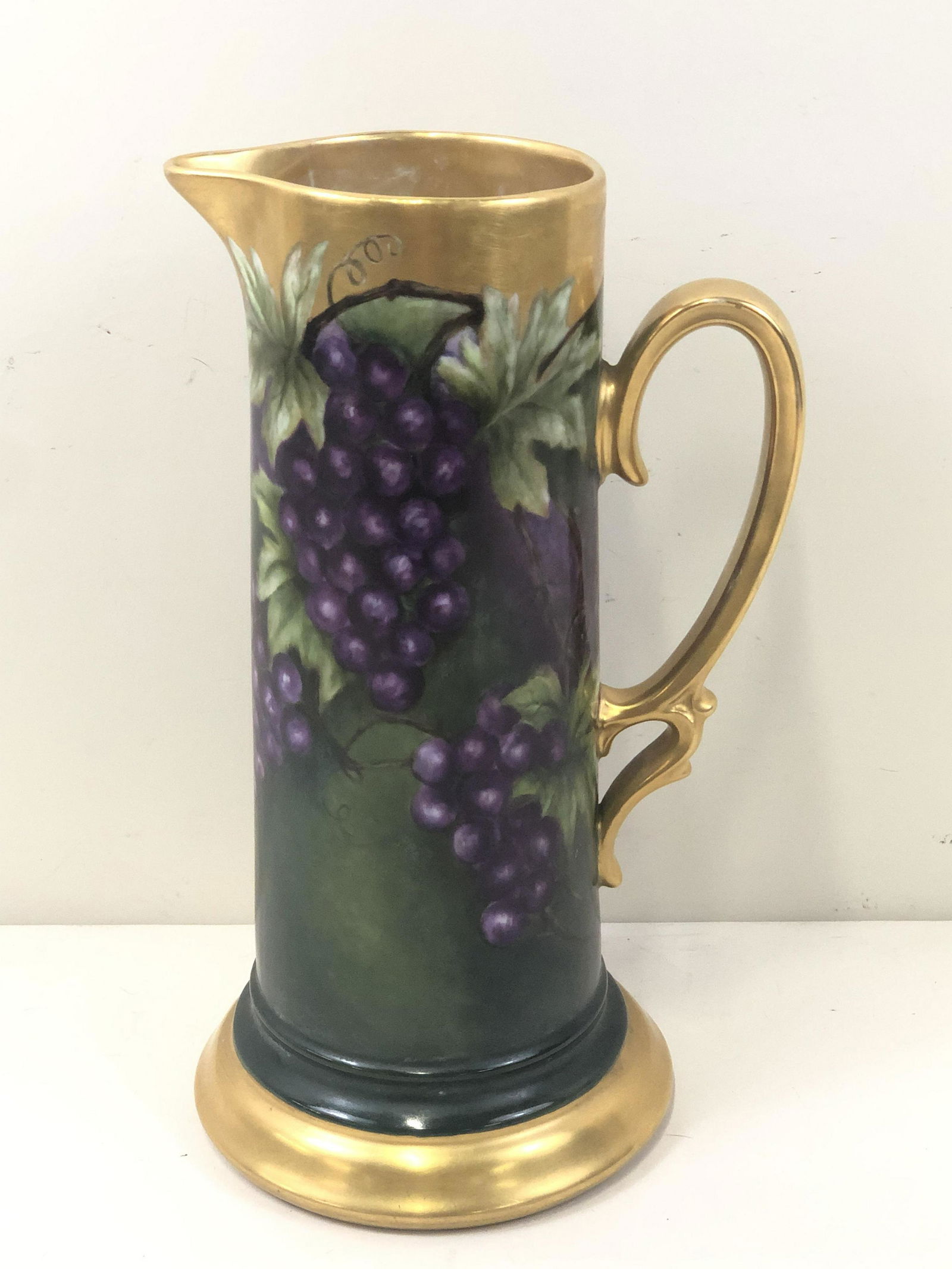 Grape Painted Pitcher: Unmarked. 6 1/2" wide x 6 1/2" deep x 12 1/4" high.