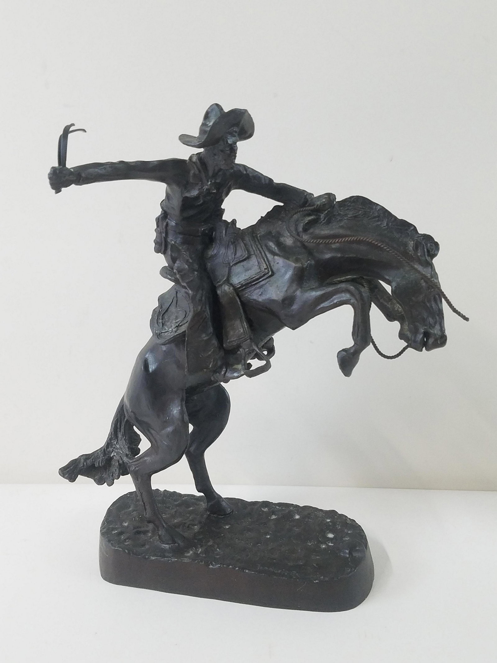 Frederick Remington Bronze: Recast. 10" wide x 12-1/2" high.