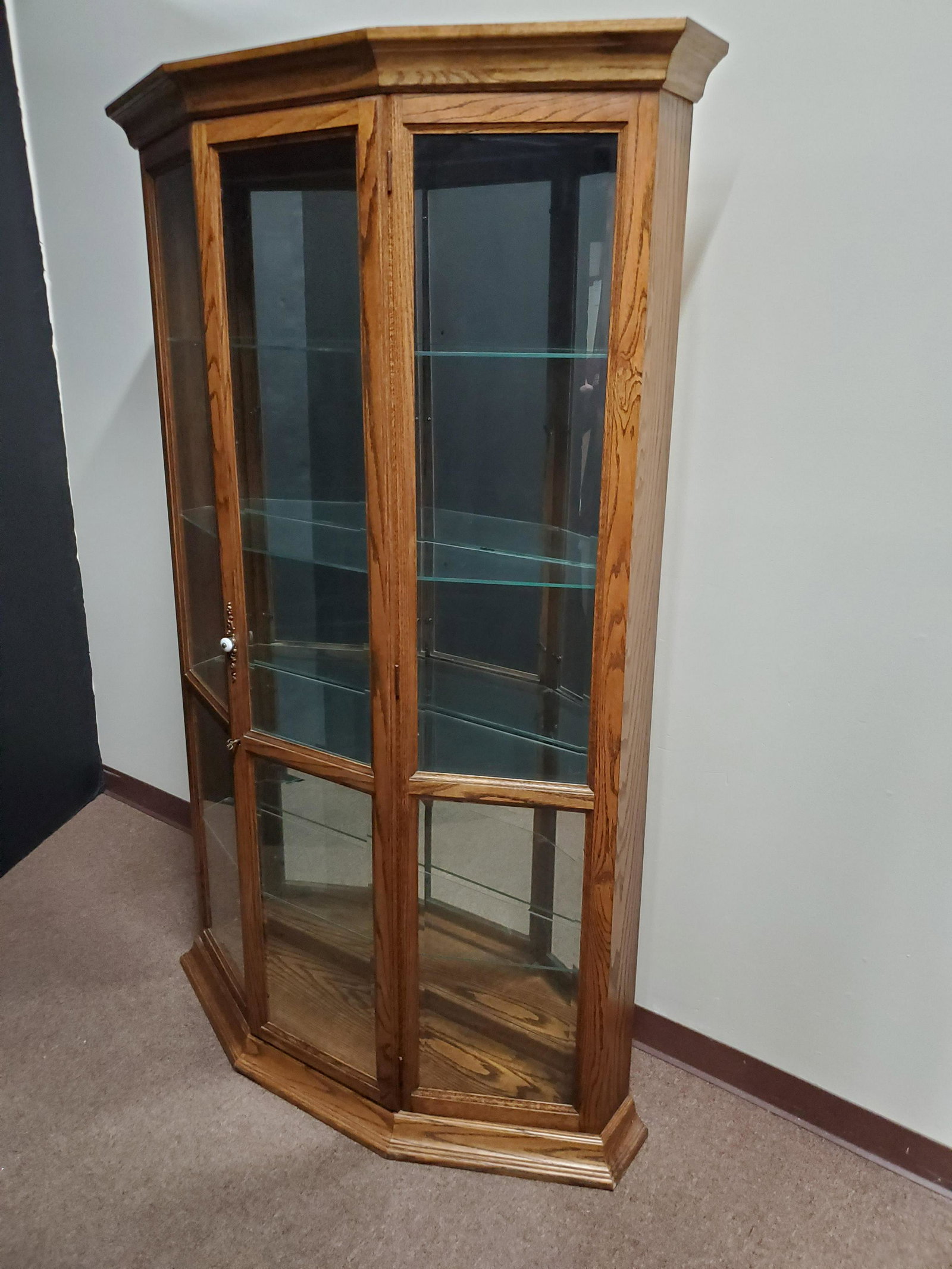 Lighted Curio Cabinet: 47" wide X 12" deep X 73 1/2" high. In working order.