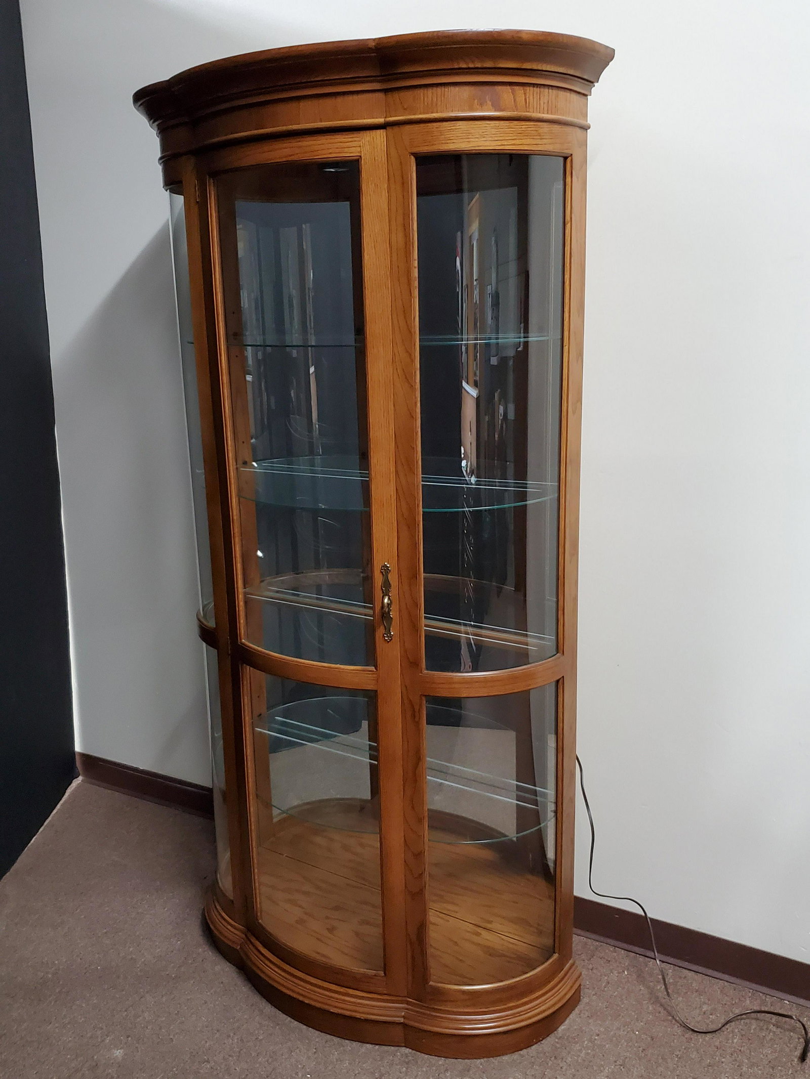 Lighted Curio Cabinet: 36" wide X 16 1/2" deep X 76" high. In working order.