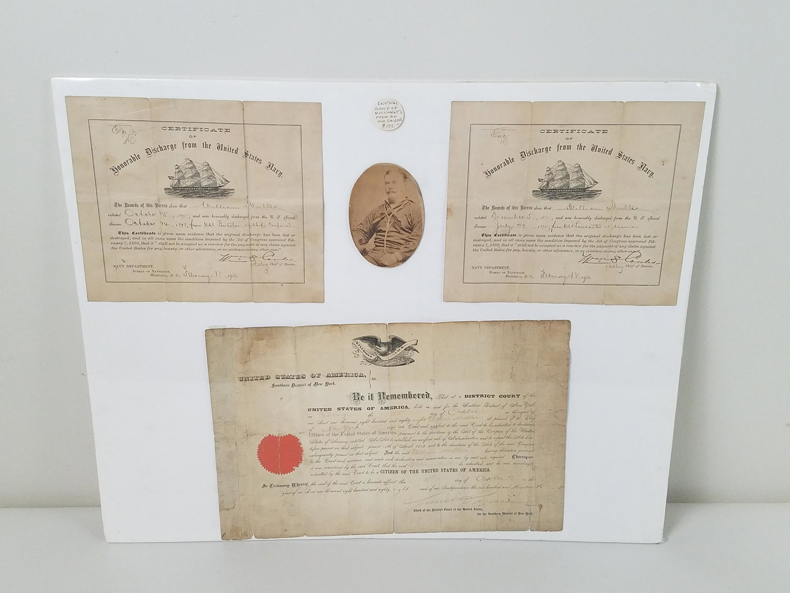 2 Naval Discharge and Remembrance Certificates: Also includes sailors photograph. Overall 21" high x 26" wide. From the Estate Collection of Stephen R. Reed.