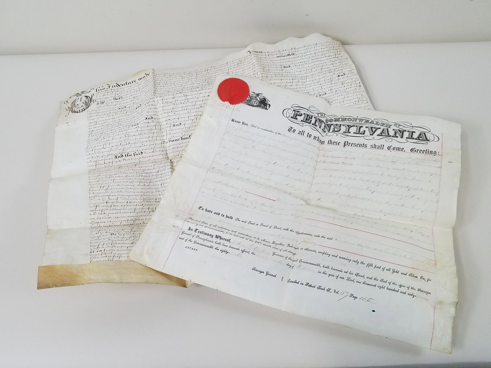 Andrew Curtin Deed and Folk Art English Deed: A Pennsylvania property warrant signed Andrew Curtin in the upper right corner accompanied by an English folk art vellum deed. Wear consistent with age. From the Estate Collection of Stephen R. Reed.