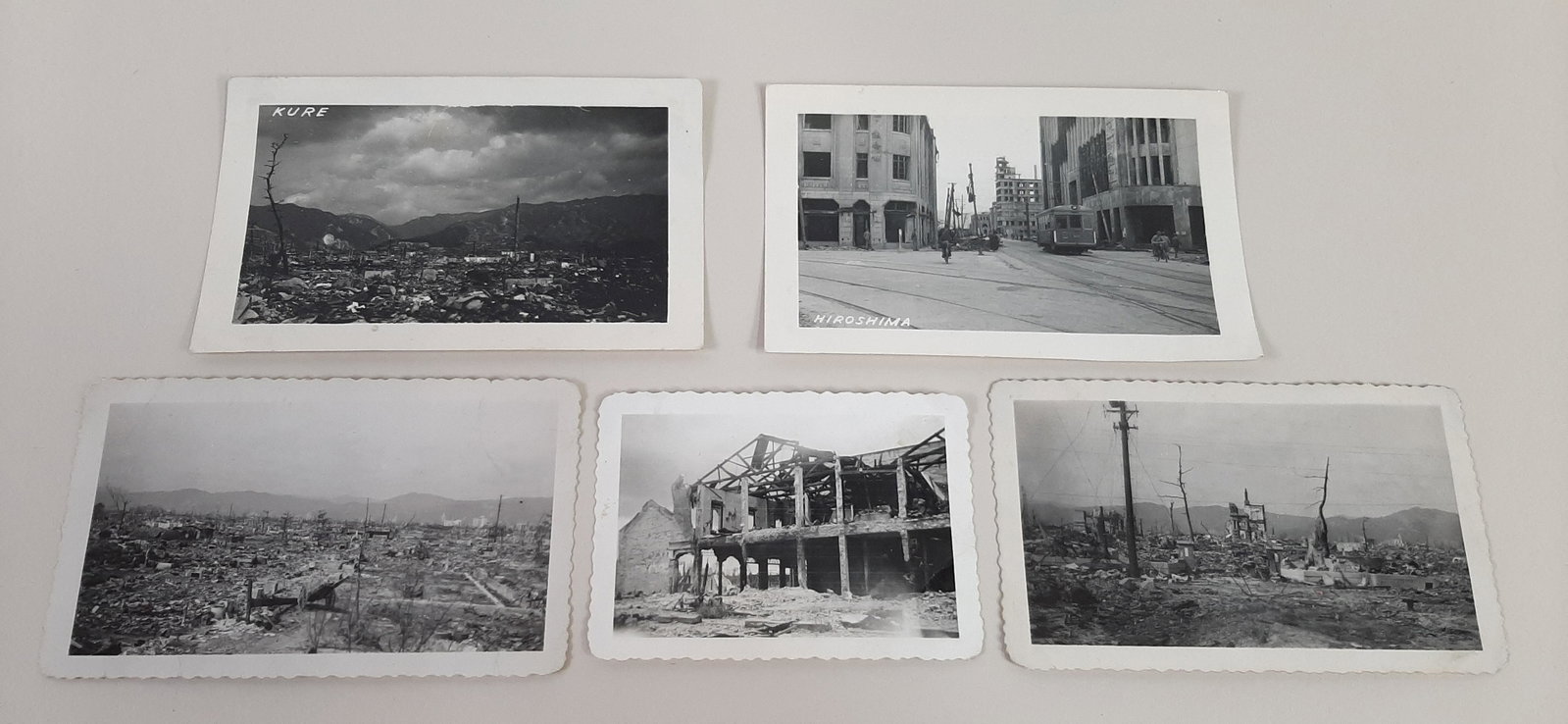 5 WWII Photographs incl. Hiroshima: Photographs of destruction in Japanese cities including Hiroshima and Kure. 3 1/2" to 5" wide X 2 1/2" to 3" high. From the Estate Collection of Stephen R. Reed.