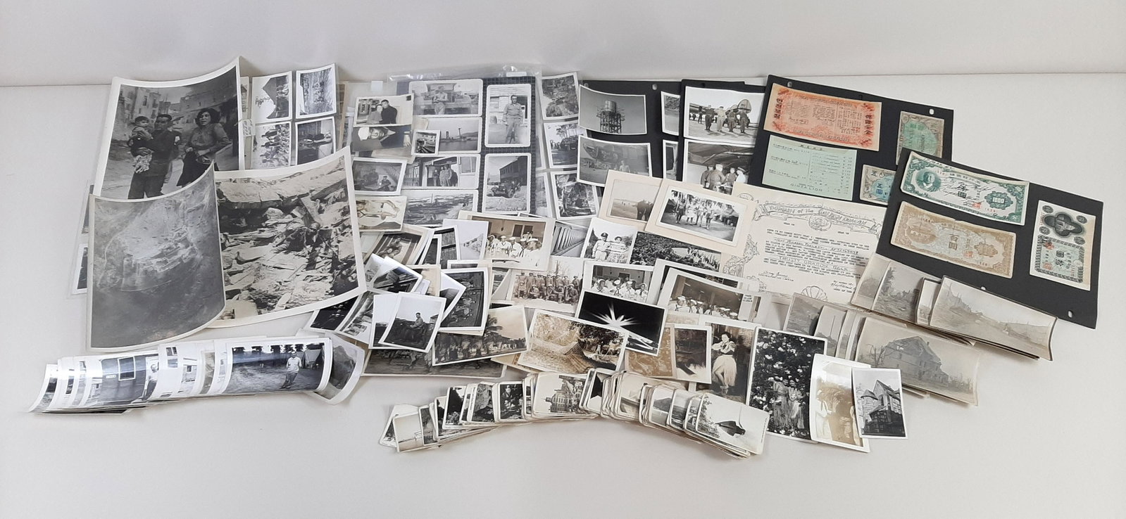 Large Grouping of Military Photos: Includes 101st Airborne WWII Photos. Also includes Japanese currency. From the Estate Collection of Stephen R. Reed.