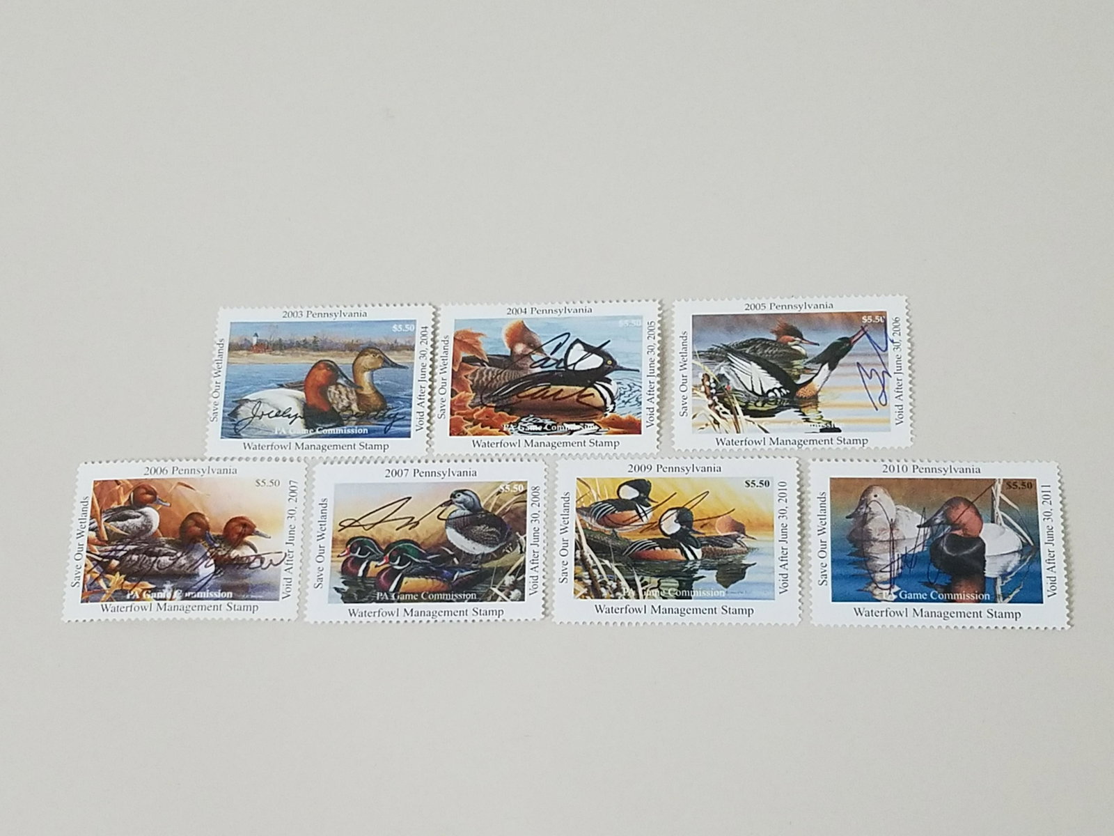 7 Signed PA Game Commission Duck Stamps: Includes 2003, 2004, 2005, 2006, 2007, 2009 and 2010. From the Estate Collection of Stephen R. Reed.