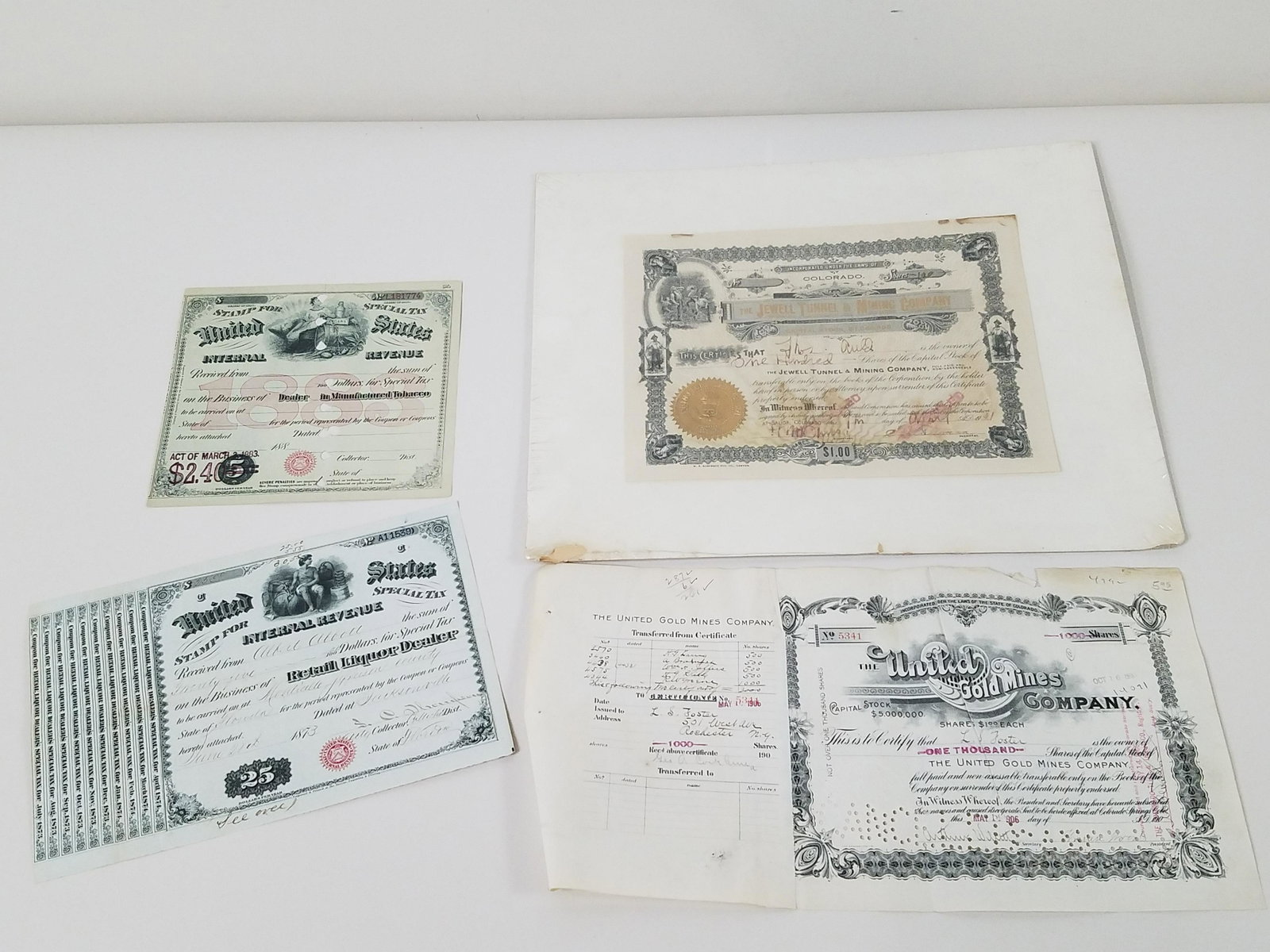 4 Stock and Revenue Certificates: Includes tobacco and mining. From the Estate Collection of Stephen R. Reed.