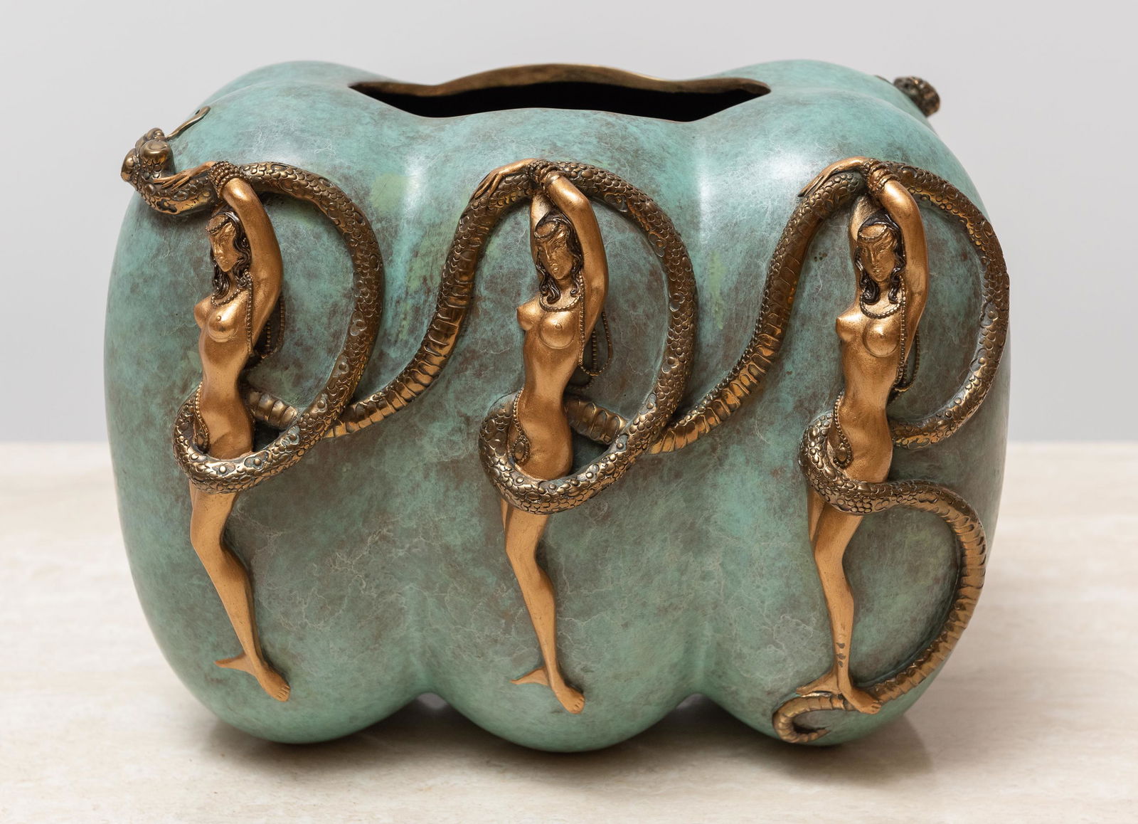 Erte (Russian/French, 1892-1990): Patinated bronze vase. Eve. Nude figures entwined with serpents. Seven Arts, Ltd. London, 1989. MEASUREMENTS: 10" wide x 9" high. IMPORTANT: Before bidding, please read the terms and conditions. When