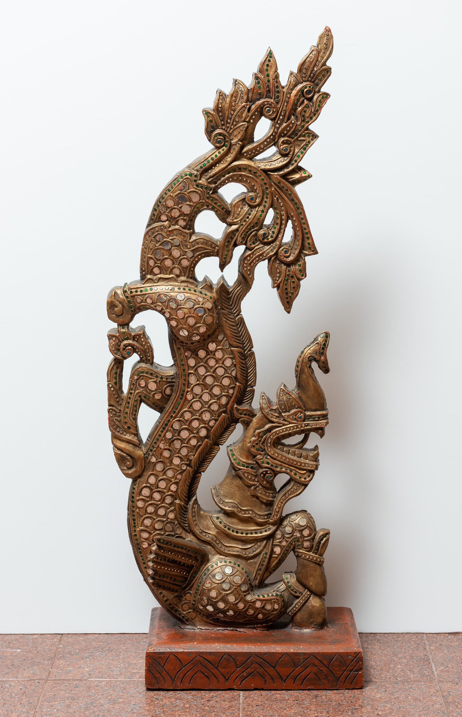 Indonesian Carved Wood Mirrored Dragon: 39 3/4" high x 16 1/4" wide. IMPORTANT: Before bidding, please read the terms and conditions. When you registered for the auction you agreed to these terms and will be required to comply with them.