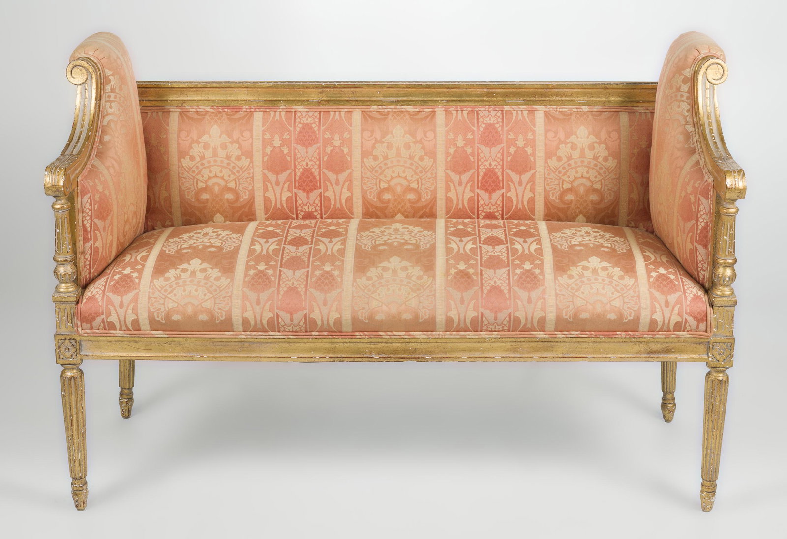 French Canape with Pink Silk Upholstery: DESCRIPTION: French canape with pink silk upholstery and carved gilt frame. MEASUREMENTS: 46" long x 20" deep x 32" high. CONDITION: No defects noted. IMPORTANT: Before bidding, please read the terms 