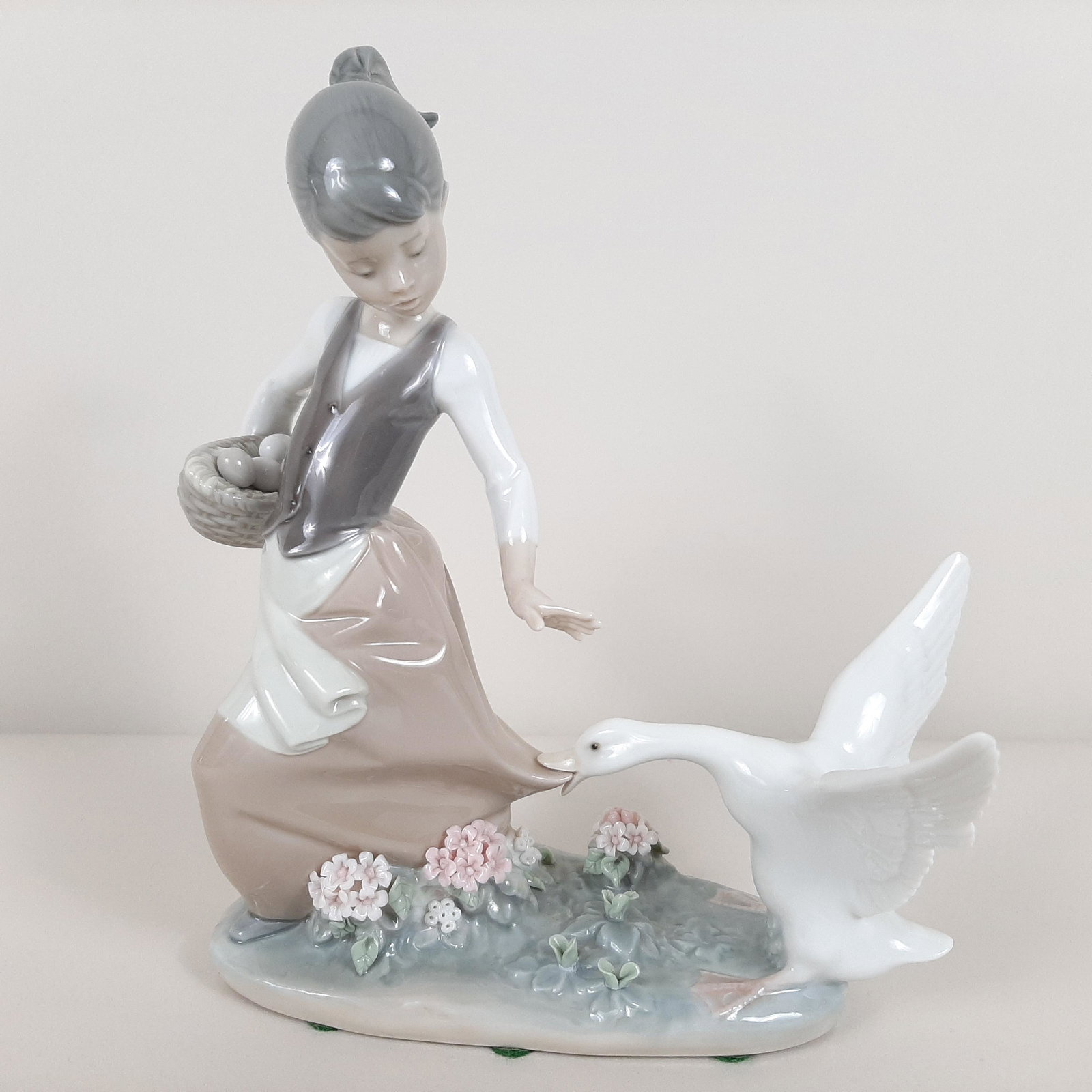 Lladro Girl and Goose Figurine: 7" wide X 3" deep X 8" high. IMPORTANT: Before bidding, please read the terms and conditions. When you registered for the auction you agreed to these terms and will be required to comply with them.