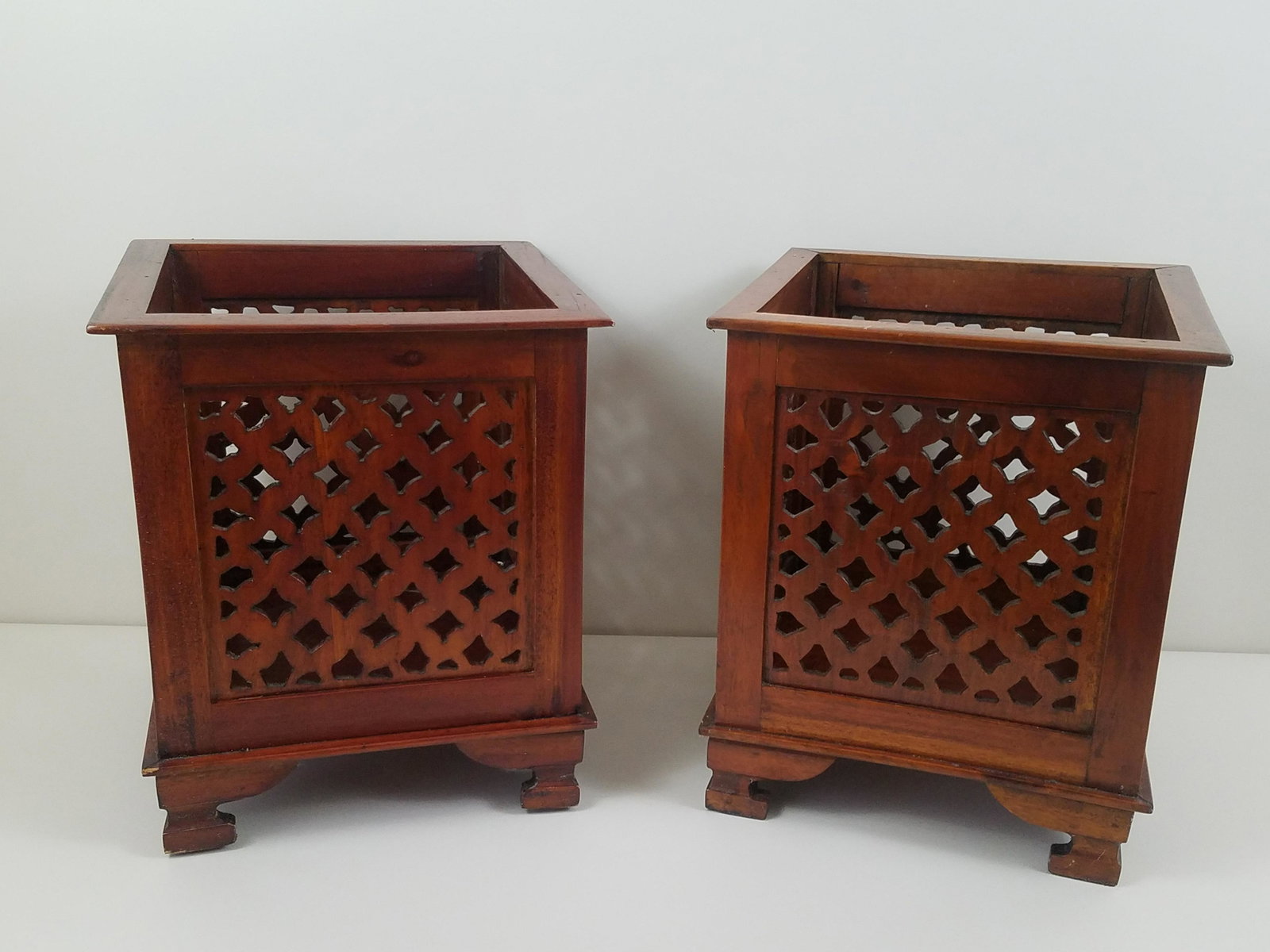 Pair of Wood Planter Holders: Made in Indonesia. Each 13" wide x 13" deep x 15-1/2" high. IMPORTANT: Before bidding, please read the terms and conditions. When you registered for the auction you agreed to these terms and will be r