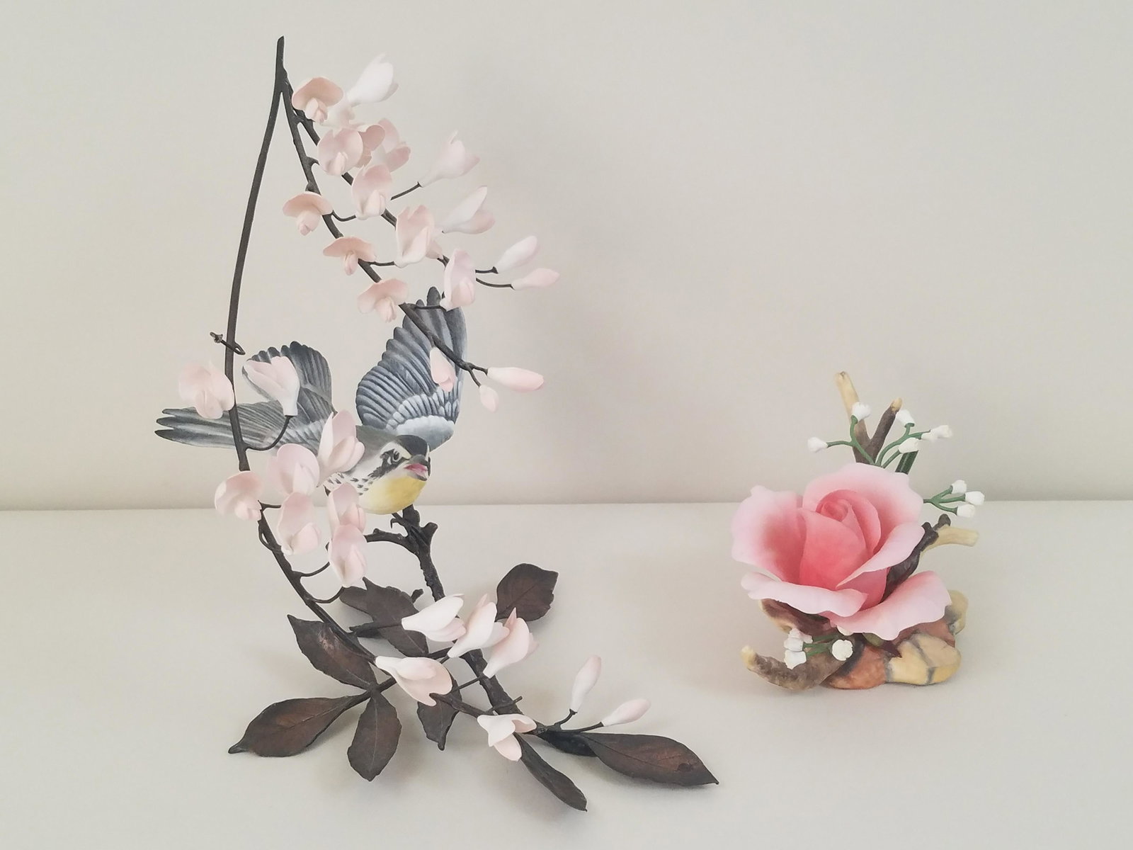2 Boehm Birds and Flowers: Includes Royal Blessing and Warbler on metal branches. 3-1/2" to 9" high. IMPORTANT: Before bidding, please read the terms and conditions. When you registered for the auction you agreed to these terms