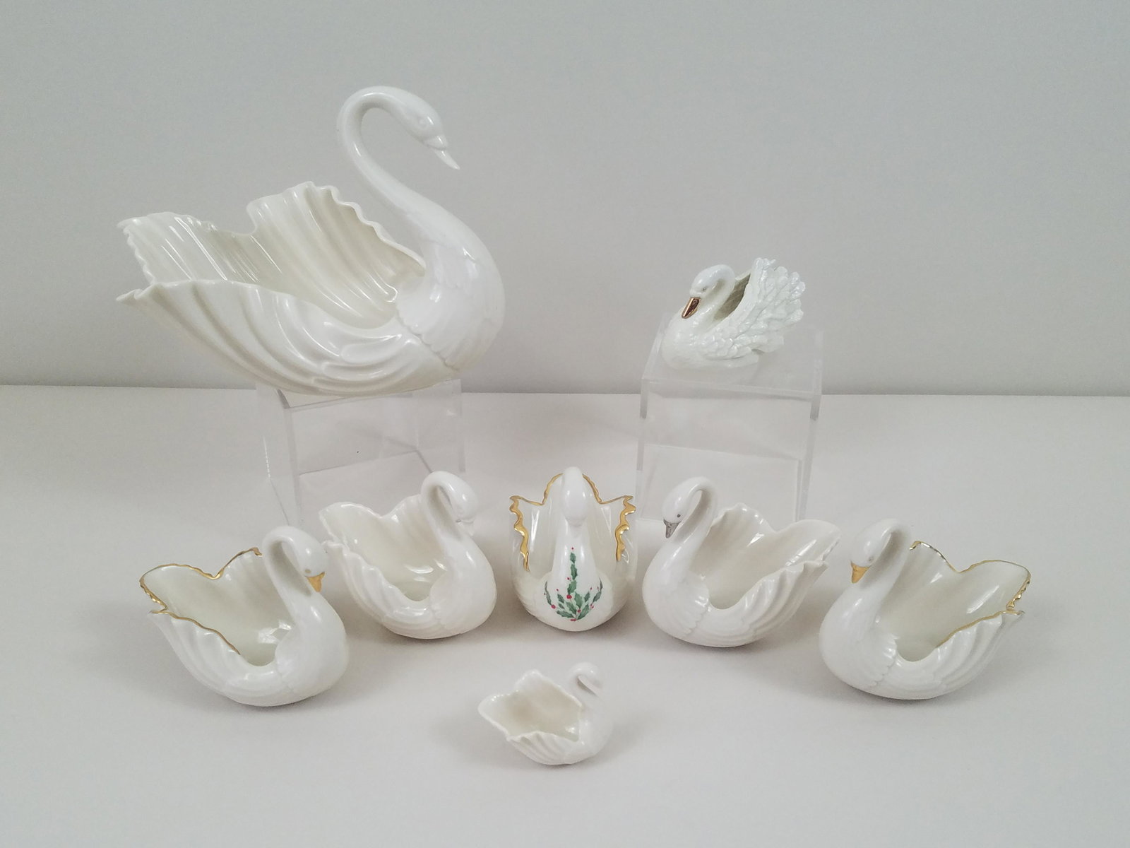 8 Lenox Swans: 2" to 6-1/2" high. IMPORTANT: Before bidding, please read the terms and conditions. When you registered for the auction you agreed to these terms and will be required to comply with them.