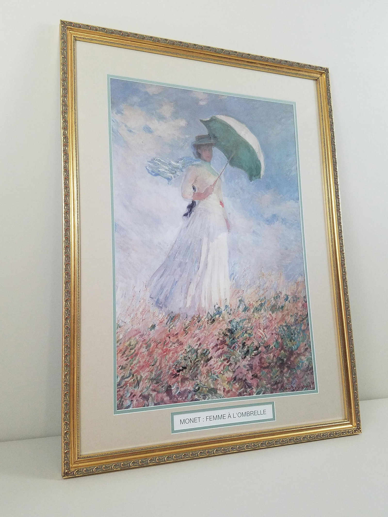 Monet Woman with Parasol Print: Overall with frame 34-1/2" high x 25-1/2" wide. IMPORTANT: Before bidding, please read the terms and conditions. When you registered for the auction you agreed to these terms and will be required to c