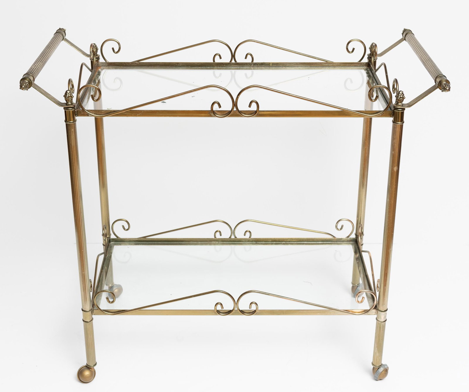 Brass and Glass Tea Cart: 39" wide x 21" deep x 34" high. Corrosion to brass. IMPORTANT: Before bidding, please read the terms and conditions. When you registered for the auction you agreed to these terms and will be required 