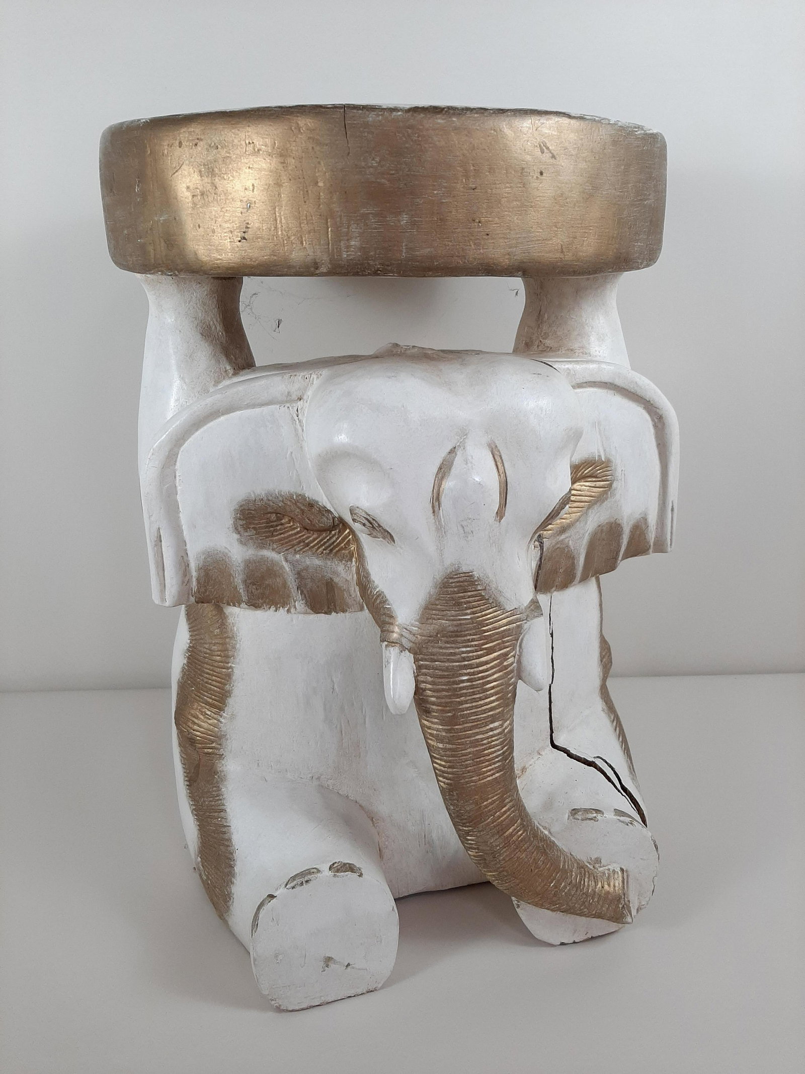 Painted Wood Elephant Stool: 13½" diameter X 20" high. Large split to right side. IMPORTANT: Before bidding, please read the terms and conditions. When you registered for the auction you agreed to these terms and will be require