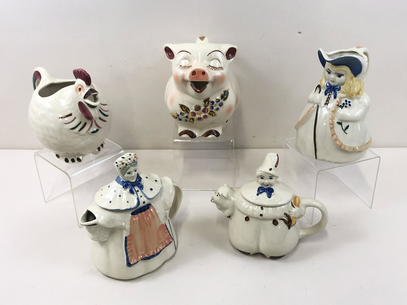 5 Pcs Character Pottery: 8 1/4" to 8 1/2" wide x 4 1/4" to 6" deep x 6 3/4" to 8" high. IMPORTANT: Before bidding, please read the terms and conditions below. When you registered for the auction you agreed to these terms and
