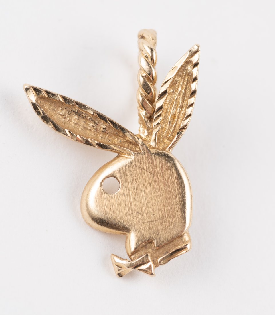 14K Playboy Bunny Pendant: 1-1/4" long. 1dwt IMPORTANT: Before bidding, please read the terms and conditions. When you registered for the auction you agreed to these terms and will be required to comply with them.