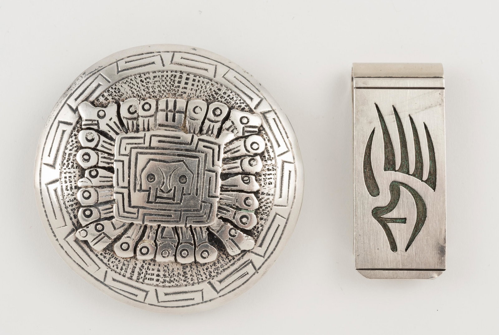 Peruvian Buckle & Native Amer Money Clip: Both sterling. Money clip signed VR. Buckle signed Q. Buckle 2-1/4" diameter. Money clip 1-3/4" wide. IMPORTANT: Before bidding, please read the terms and conditions. When you registered for the aucti