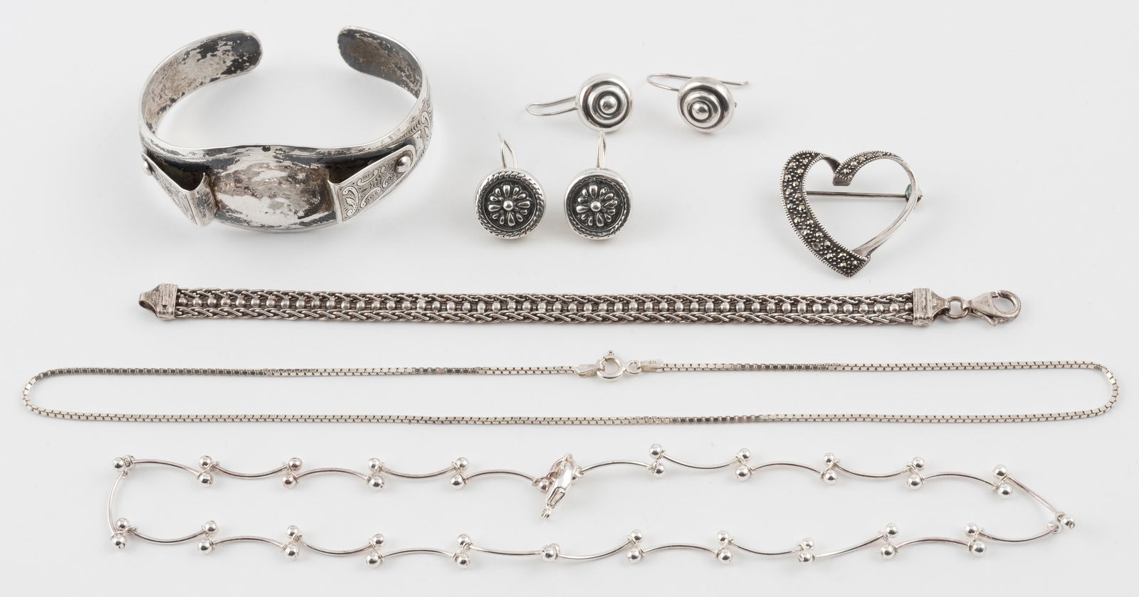 7 Pc Sterling Jewelry: Chain 17" long. Heart pendant 1" wide. Bracelet 7-1/4" long. IMPORTANT: Before bidding, please read the terms and conditions. When you registered for the auction you agreed to these terms and will be
