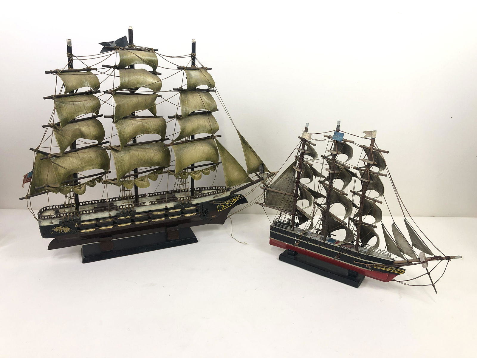 2 Model Ships: Including Cutty Sark. 15" to 23 1/2" high x 19 1/2" to 28" wide. IMPORTANT: Before bidding, please read the terms and conditions. When you registered for the auction you agreed to these terms and will
