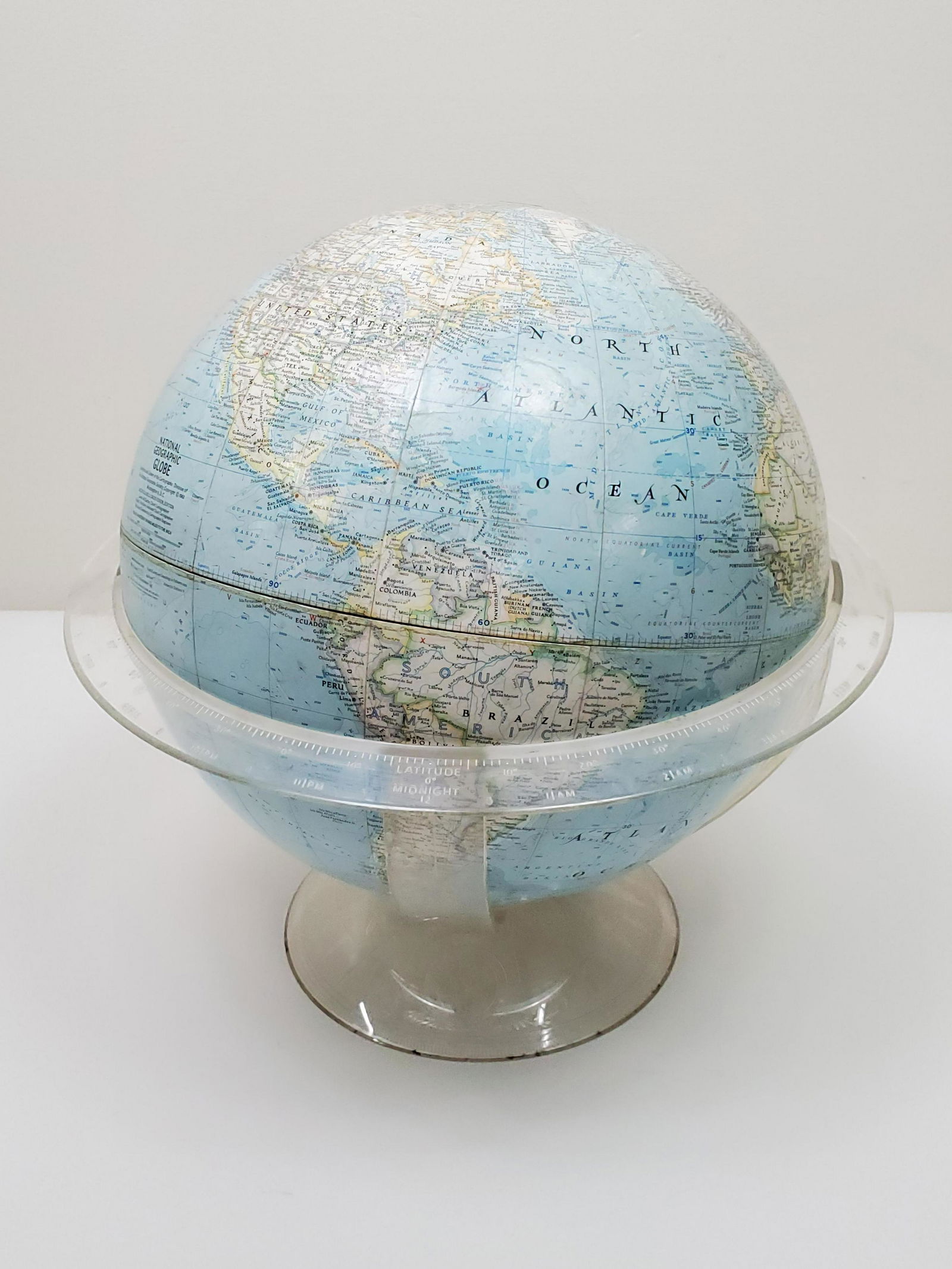 National Geographic Society World Globe: 14 1/4" diameter X 14" high. IMPORTANT: Before bidding, please read the terms and conditions. When you registered for the auction you agreed to these terms and will be required to comply with them.