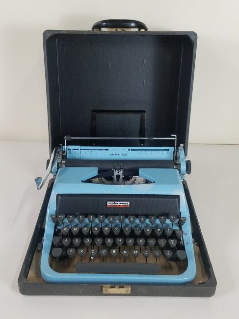 Underwood Golden Touch Portable Typewriter: 13½" wide X 13½" deep X 7¼" high (closed). IMPORTANT: Before bidding, please read the terms and conditions. When you registered for the auction you agreed to these terms and will be required to com