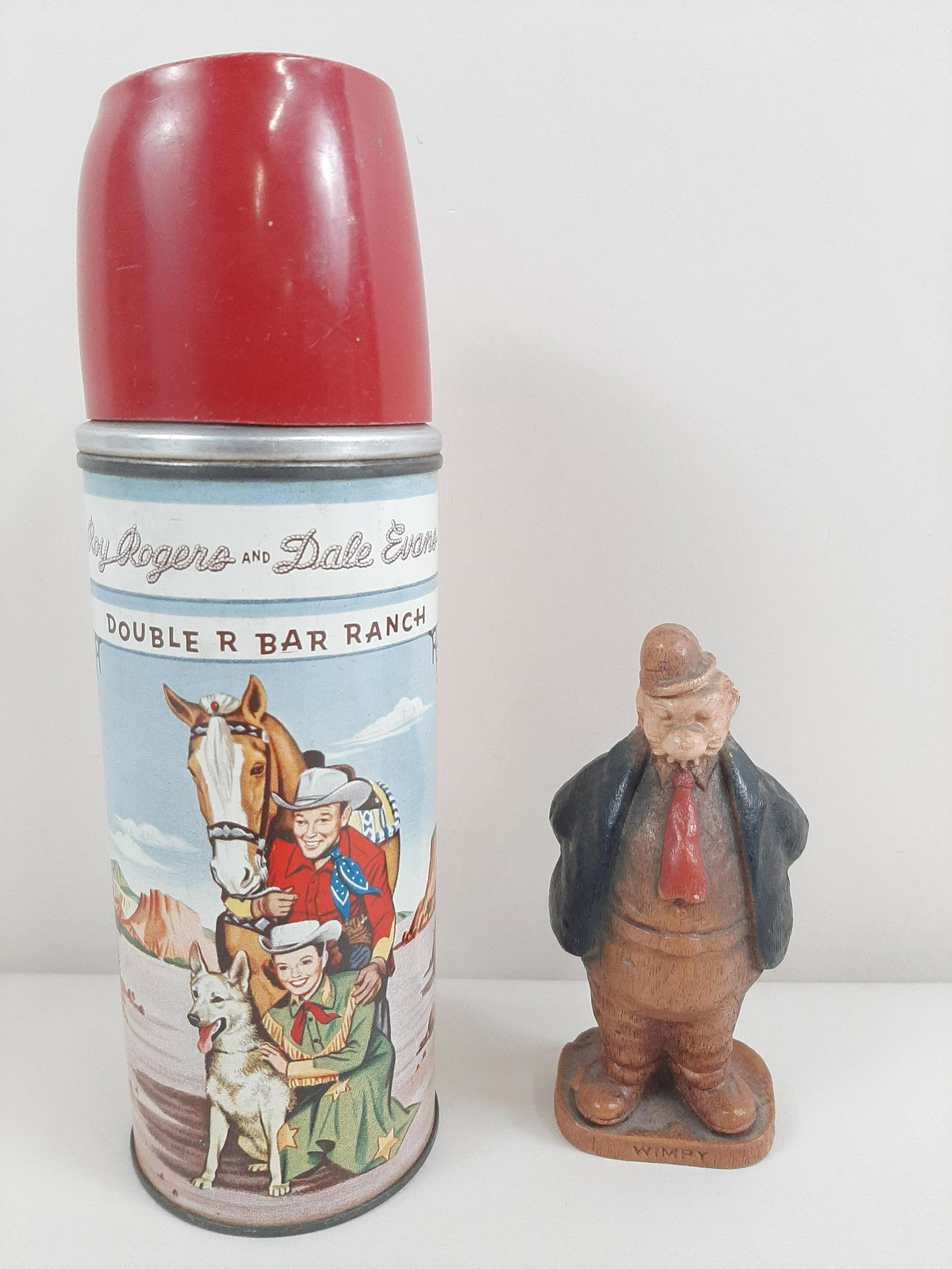 Roy Rogers Thermos and Wimpy Figurine: Includes #2177 Roy Rogers and Dale Evans Double R Bar Ranch thermos. IMPORTANT: Before bidding, please read the terms and conditions. When you registered for the auction you agreed to these terms and 