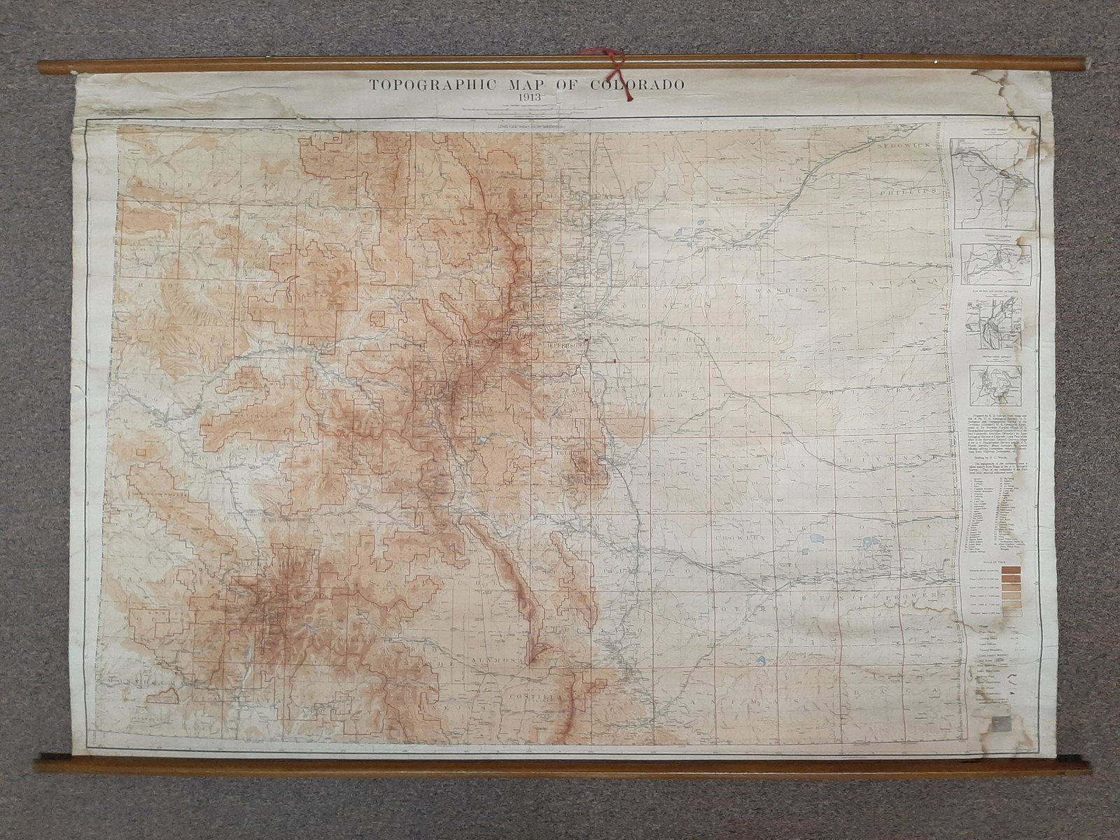 1913 Topographic Map of Colorado: 59" wide X 40¾ high. Produced by Colorado State Geological Survey. Lithography by A. Hoen & Co., Baltimore, MD. Some staining and tears to edges. Canvas backed. IMPORTANT: Before bidding, please read