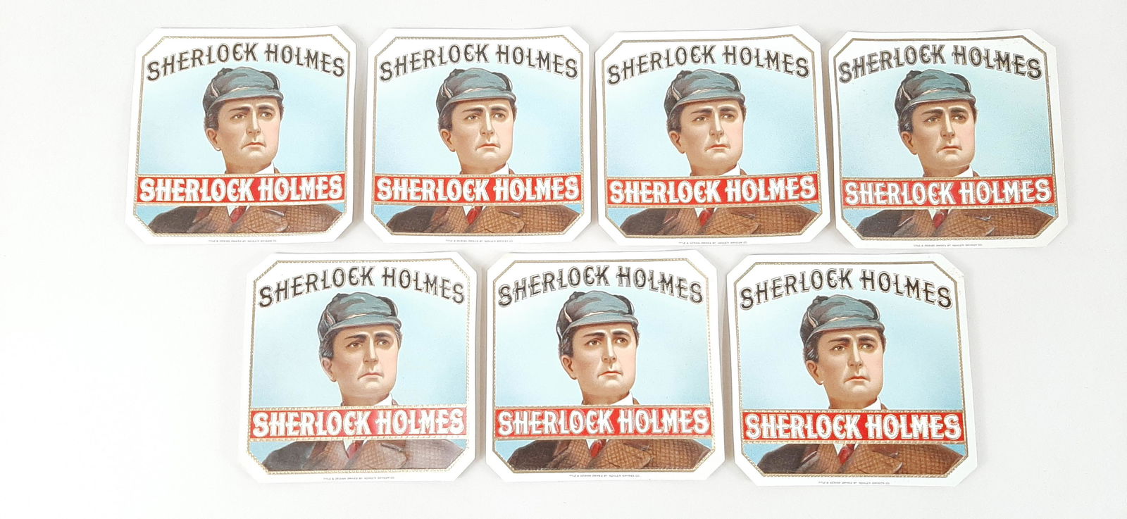 7 Sherlock Holmes Cigar Labels: Title & design owned by Kohler Snyder Co. Each 4½" wide X 4¼" high. IMPORTANT: Before bidding, please read the terms and conditions. When you registered for the auction you agreed to these terms and