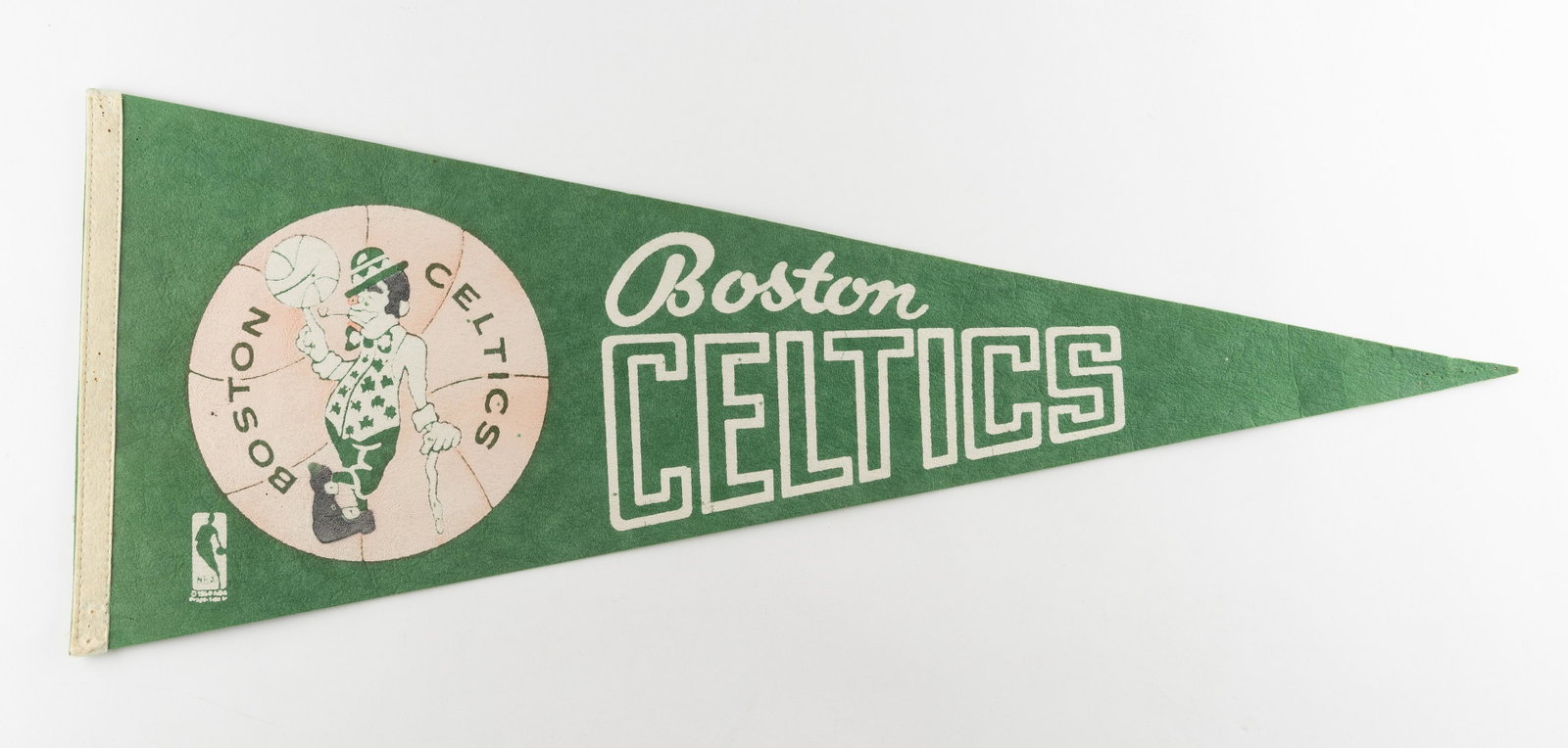 1960's Boston Celtics Pennant: CONDITION: Good. Some pinholes. IMPORTANT: Before bidding, please read the terms and conditions. When you registered for the auction you agreed to these terms and will be required to comply with them.