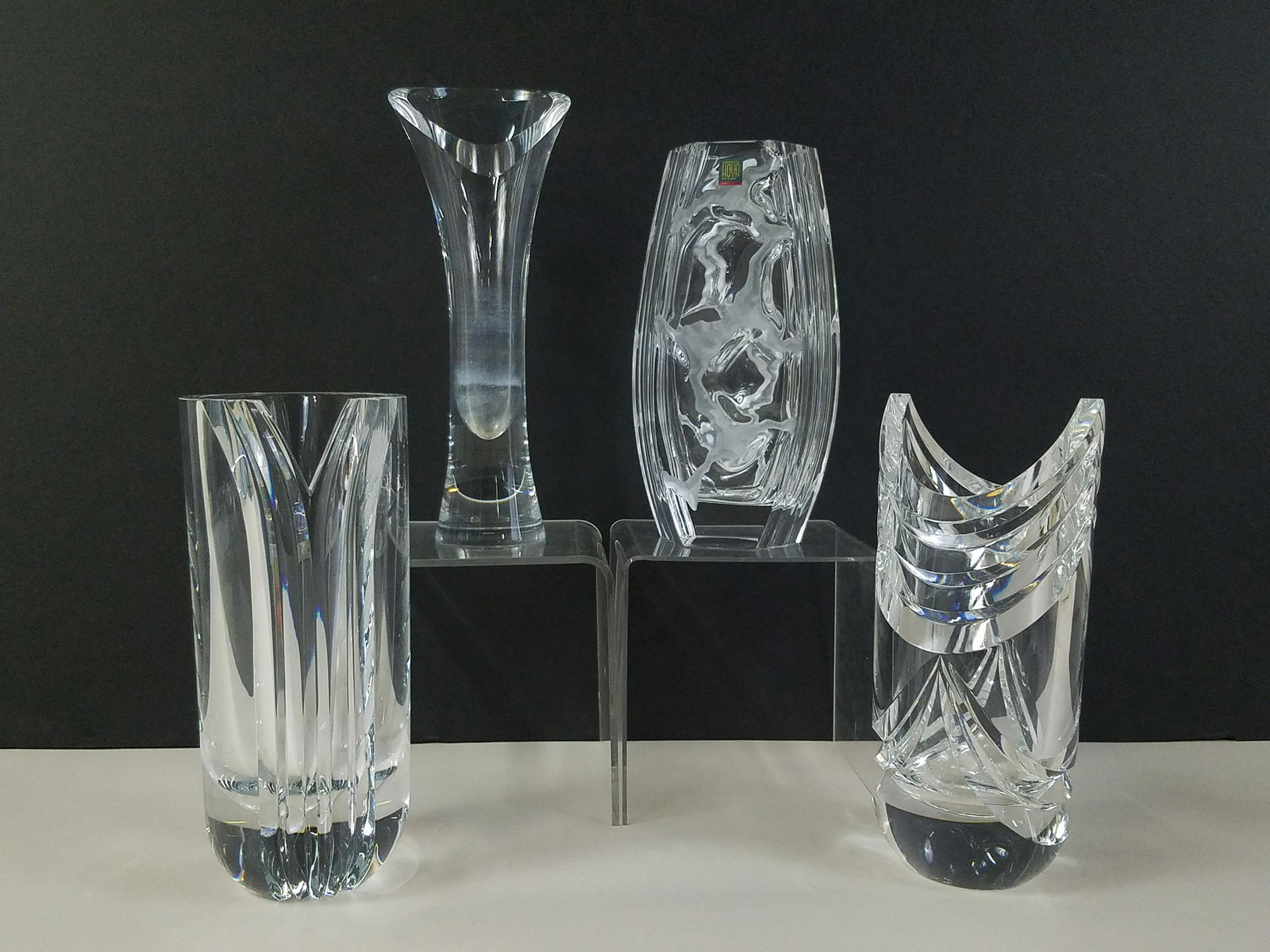 4 Hoya Leaded Crystal Vases: 9" to 11" high. IMPORTANT: Before bidding, please read the terms and conditions. When you registered for the auction you agreed to these terms and will be required to comply with them.