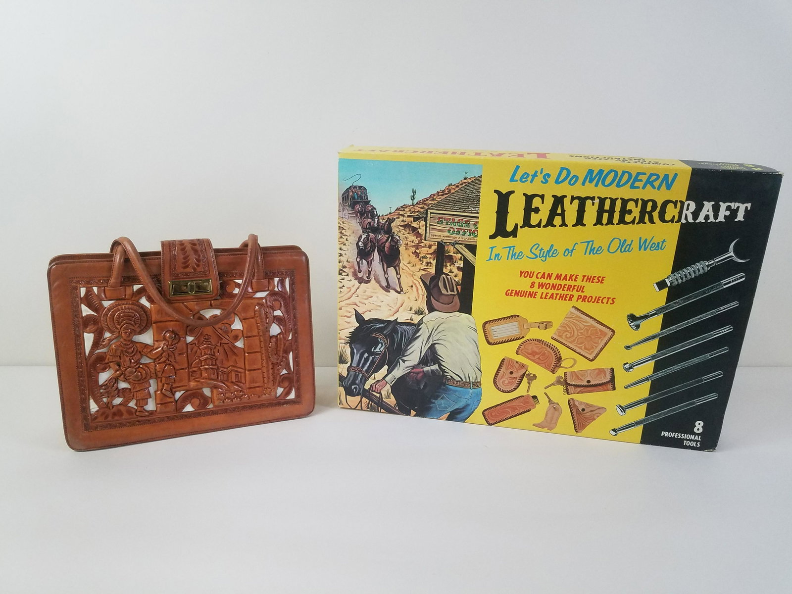 Leathercraft Tooling Kit and Tooled Leather Purse: Purse: 14" wide x 11-1/2" high. IMPORTANT: Before bidding, please read the terms and conditions. When you registered for the auction you agreed to these terms and will be required to comply with them.