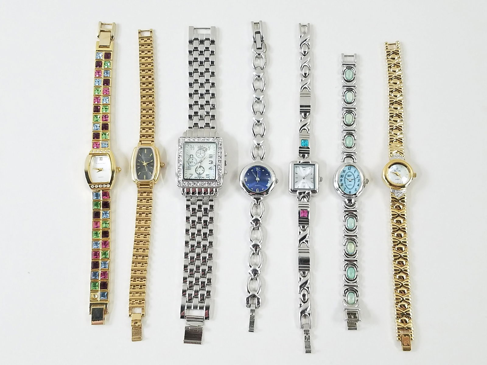 7 Wristwatches incl Vernier and Halston: Also includes Elgin. IMPORTANT: Before bidding, please read the terms and conditions. When you registered for the auction you agreed to these terms and will be required to comply with them.