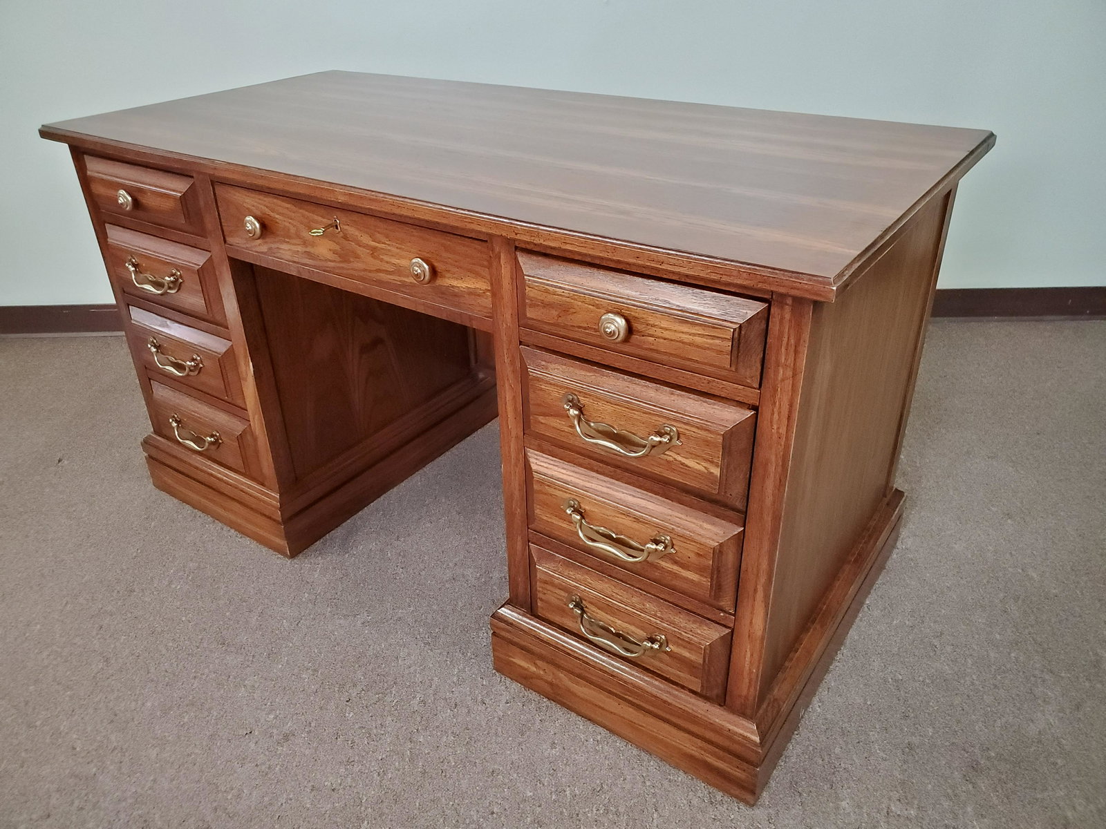 Jasper Cabinets Kneehole Desk: 55" wide X 27" deep X 30 1/4" high. IMPORTANT: Before bidding, please read the terms and conditions. When you registered for the auction you agreed to these terms and will be required to comply with t