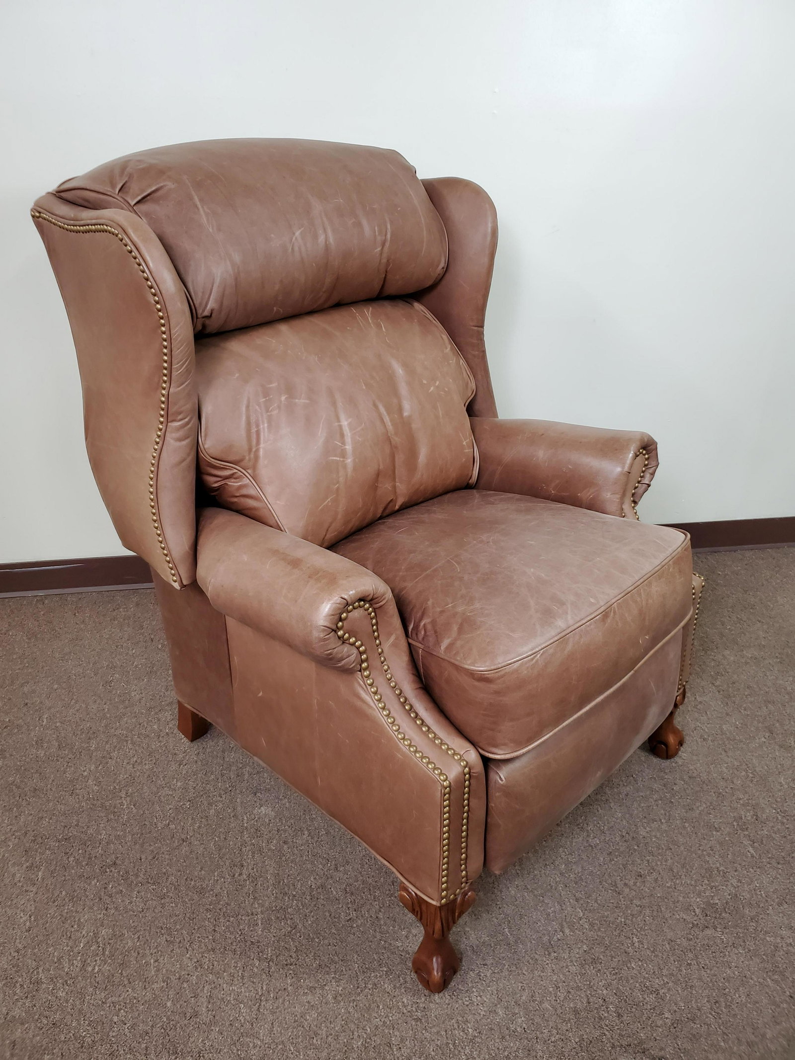 Flexsteel Full Aniline Top Grain Leather Recliner: 34" wide X 31" deep X 44" high. Leather has some scuffs. IMPORTANT: Before bidding, please read the terms and conditions. When you registered for the auction you agreed to these terms and will be requ