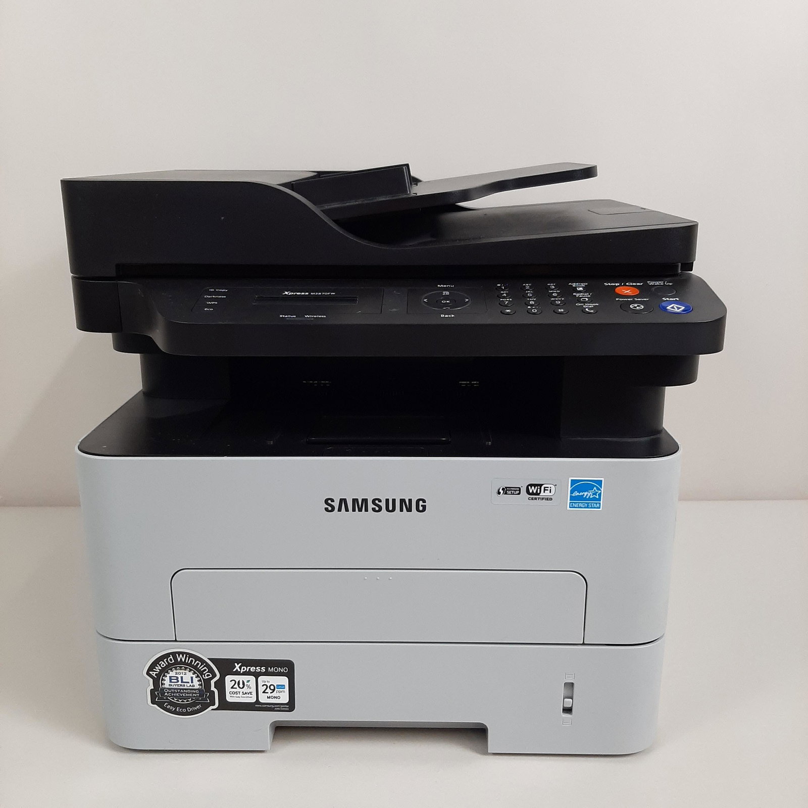 Samsung Xpress Mono Printer/Copier: Working. Model no. M2870FW. Serial no. ZELYBJDD6000APA. 15½" wide X 14" high. IMPORTANT: Before bidding, please read the terms and conditions. When you registered for the auction you agreed to these 