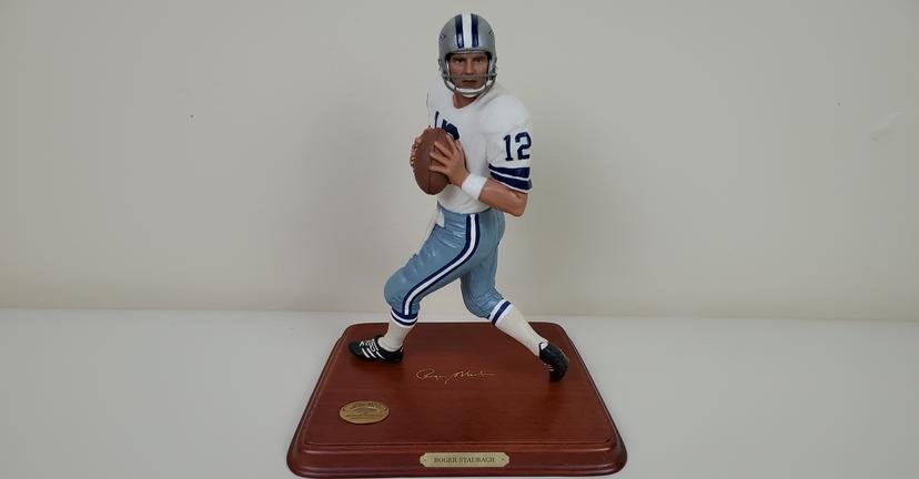 Roger Staubach All Star Figure: Danbury Mint. 7 1/2" wide X 5 1/4" deep X 8 3/4" high. IMPORTANT: Before bidding, please read the terms and conditions. When you registered for the auction you agreed to these terms and will be requir