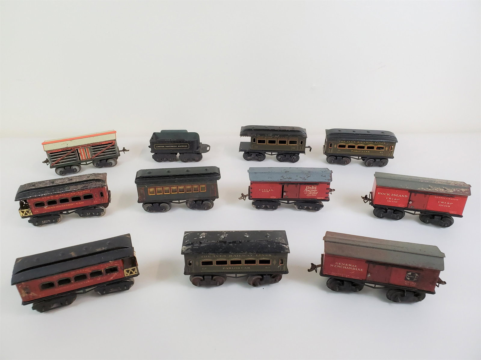 11 Pcs Ives Passenger & Freight Cars: With paint loss and corrosion. IMPORTANT: Before bidding, please read the terms and conditions. When you registered for the auction you agreed to these terms and will be required to comply with them.