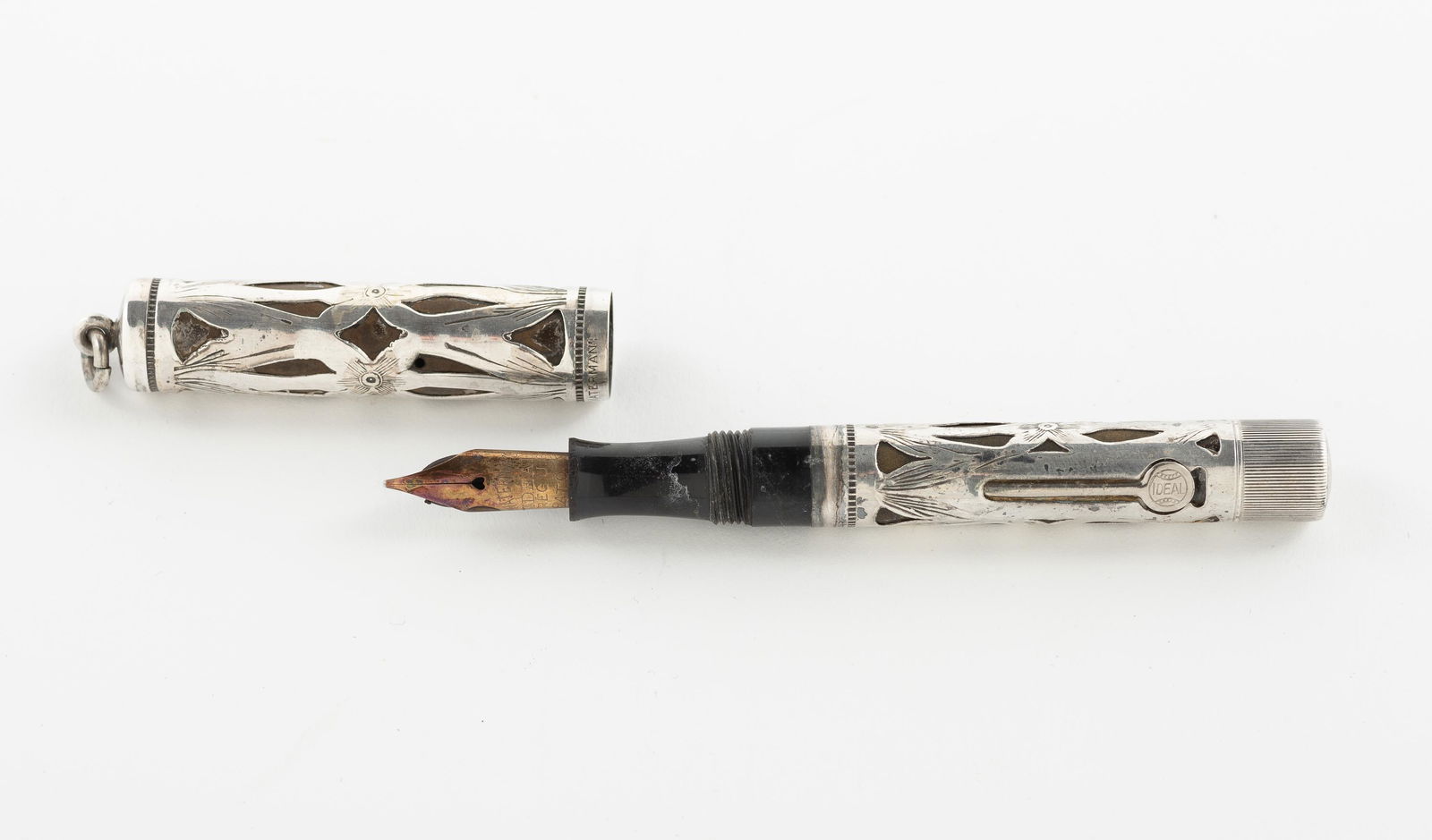 Sterling Waterman's Fountain Pen: Sterling overlay. 452 1/2 V IDEAL. 4" long. IMPORTANT: Before bidding, please read the terms and conditions. When you registered for the auction you agreed to these terms and will be required to compl