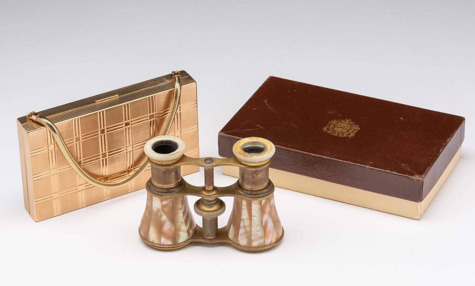 Evans Necessaire & Mother of Pearl Opera Glasses: Necessaire 5-1/2" long x 3-1/4" wide. Includes original sleeve and box. IMPORTANT: Before bidding, please read the terms and conditions. When you registered for the auction you agreed to these terms a