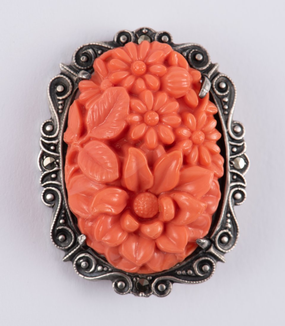 Sterling, Coral, & Marcasite Floral Brooch: 1-1/4" high. IMPORTANT: Before bidding, please read the terms and conditions. When you registered for the auction you agreed to these terms and will be required to comply with them.
